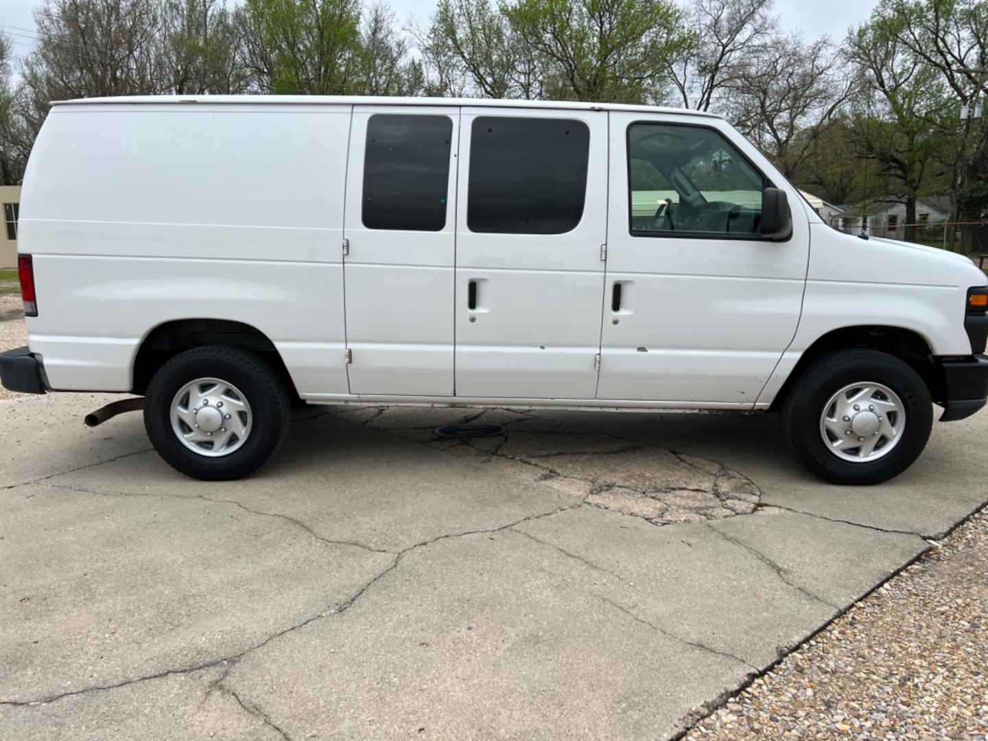 2012 White /Gray Ford E-Series Van (1FTNE2EL7CD) with an 5.4 V8 engine, Automatic transmission, located at 4520 Airline Hwy, Baton Rouge, LA, 70805, (225) 357-1497, 30.509325, -91.145432 - 2012 Ford E-250 Cargo Van 5.4 V8 Gas, 156K Miles, Power Windows & Locks, Shelves For Tools Or Parts. NO IN HOUSE FINANCING. FOR INFO PLEASE CONTACT JEFF AT 225 357-1497 CHECK OUT OUR A+ RATING WITH THE BETTER BUSINESS BUREAU WE HAVE BEEN A FAMILY OWNED AND OPERATED BUSINESS AT THE SAME LOCATION FOR - Photo#4